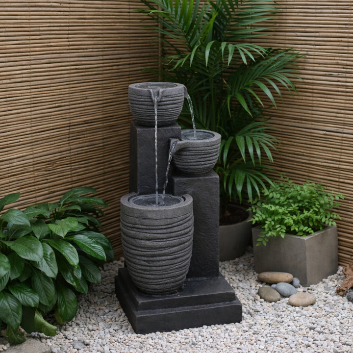 Horizontal Ribbed Pattern Outdoor Water Fountain with Warm Glow Lighting
