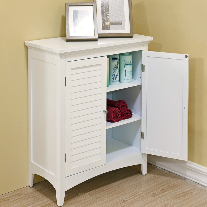 A two-door white floor cabinet with an open door