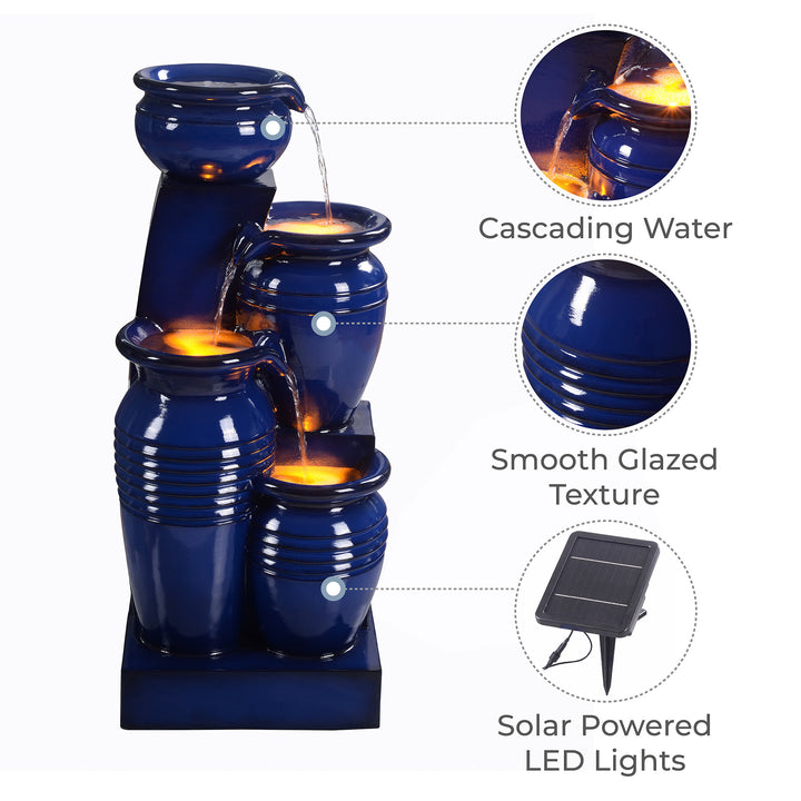 Teamson Home 28.74" 4-Tier Outdoor Solar Water Fountain with LED Lights, Navy featuring cascading water and a smooth glazed texture.