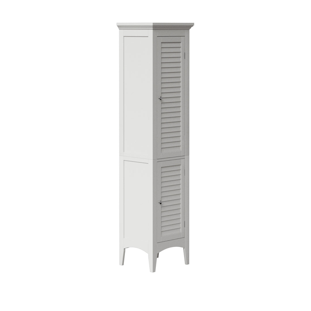 Side view of a tall whilte linen caibinet with faux louvered door