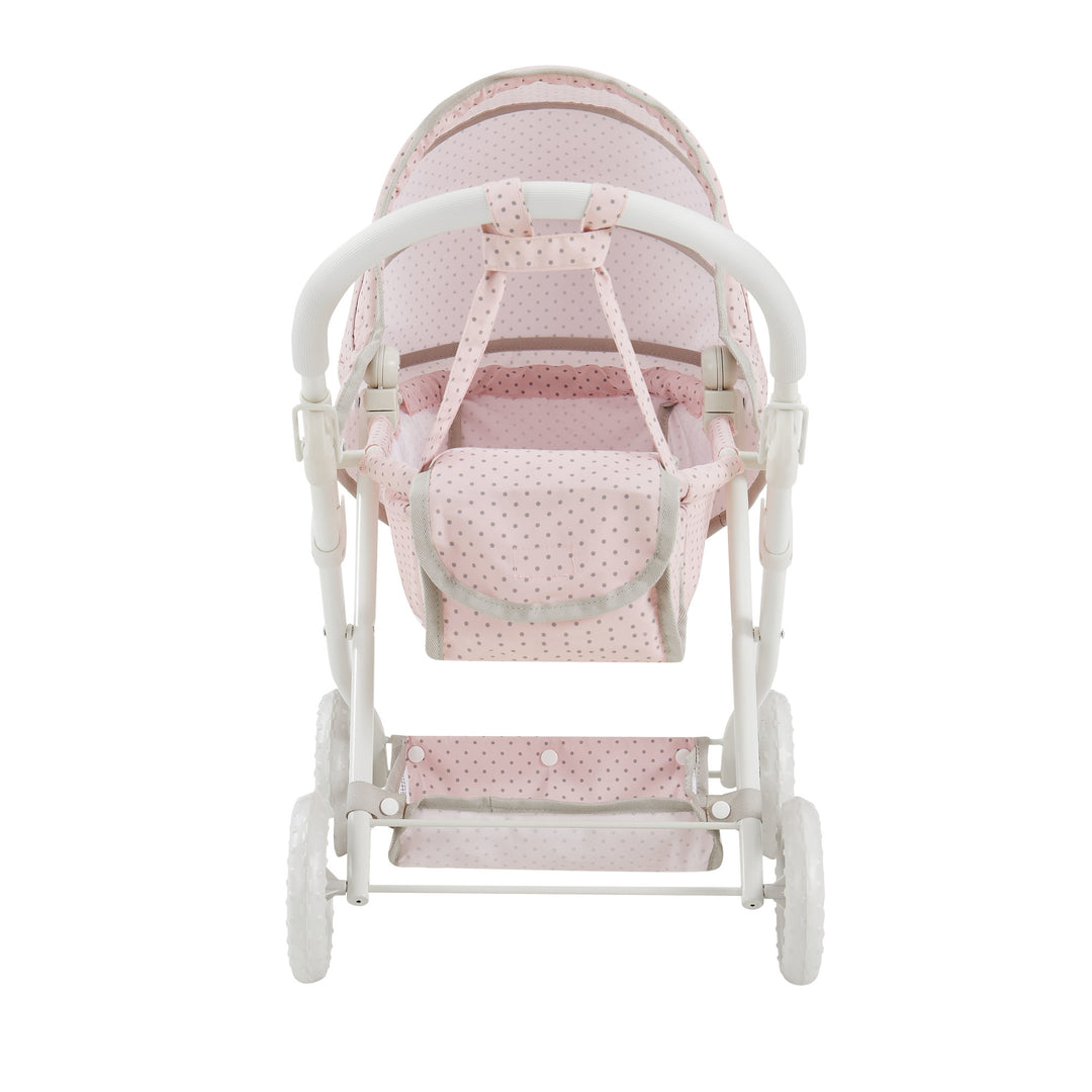 side view of the pink basinet stroller for dolls with the diaper bag attached