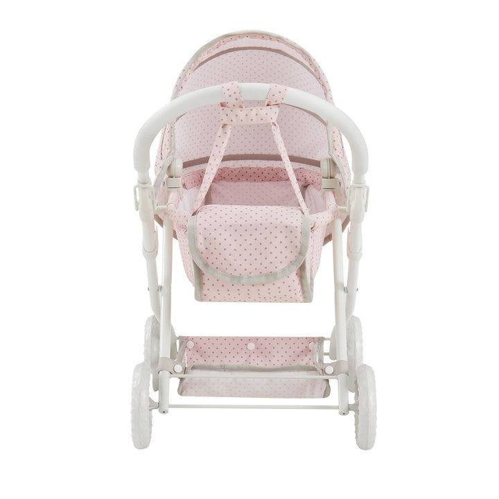 side view of the pink basinet stroller for dolls with the diaper bag attached