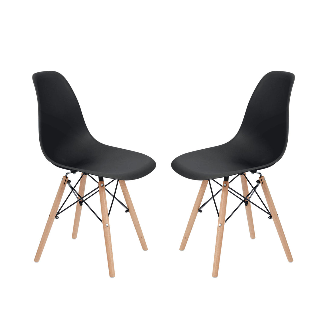 A pair of black dining chairs facing each other