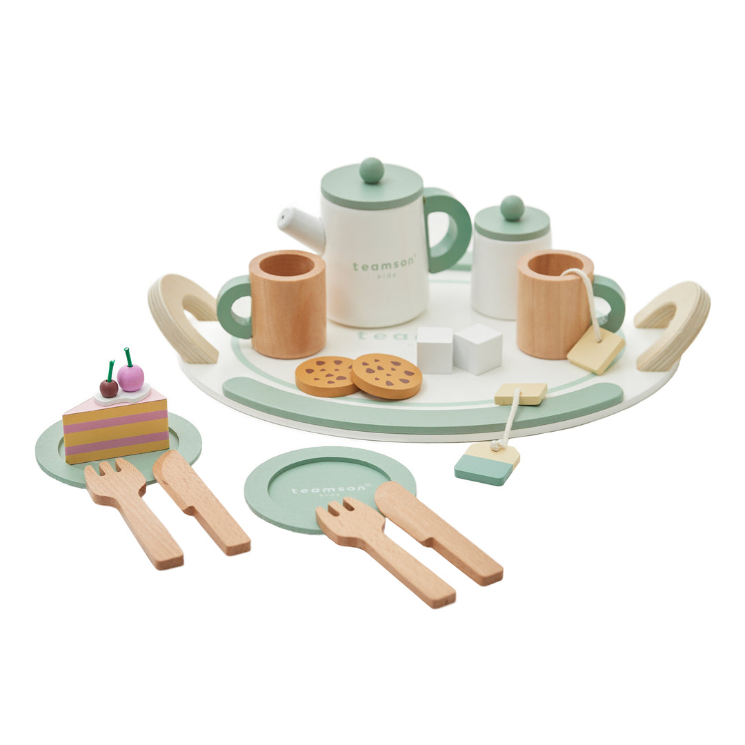 Children's wooden tea set from Teamson Kids including a teapot, cups, cookies, cake slices, utensils, and plates arranged on a tray.