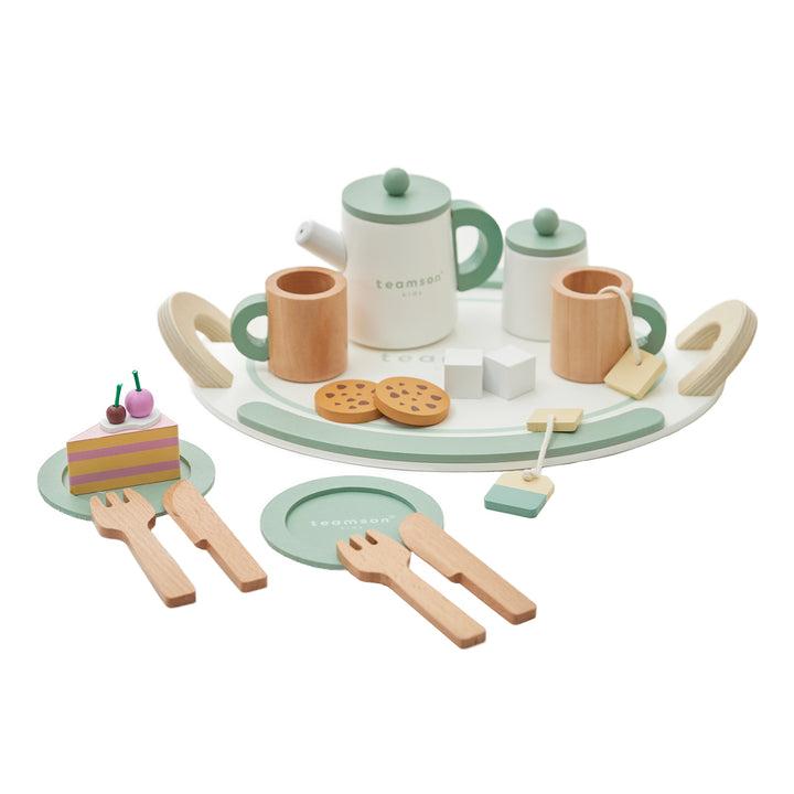 Children's wooden tea set from Teamson Kids including a teapot, cups, cookies, cake slices, utensils, and plates arranged on a tray.