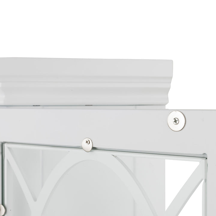 Close-up of the top of the cabinet's crown molding and the glass panel door