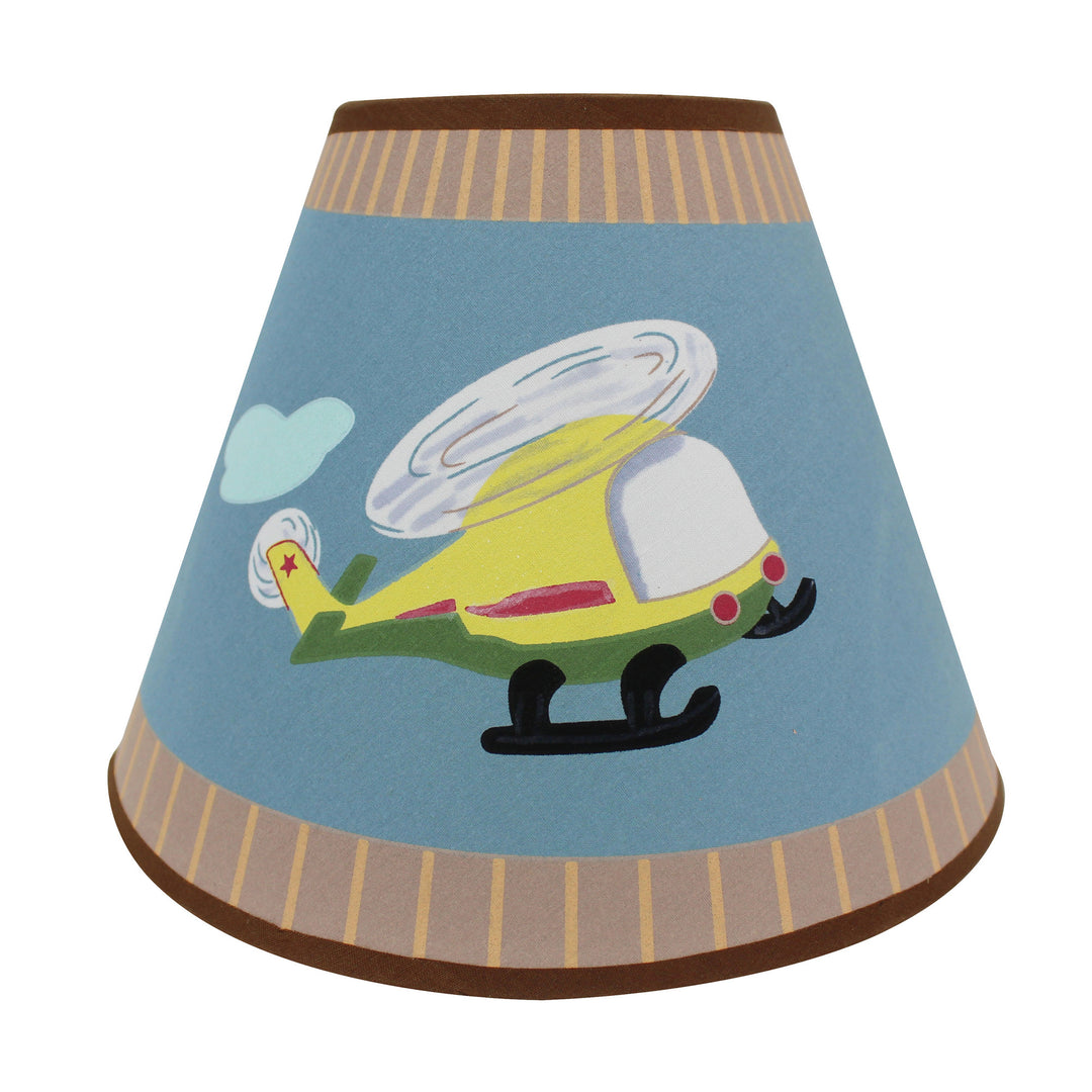 A close up of the lamp shade and the yellow helicopter on the blue field.