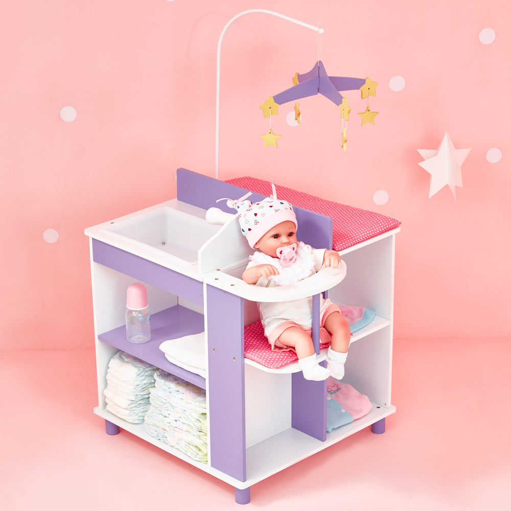 A baby doll changing station in pink, purple, and white with a closet, storage shelves, high chair, mobile, sink, and changing table in a pink room.
